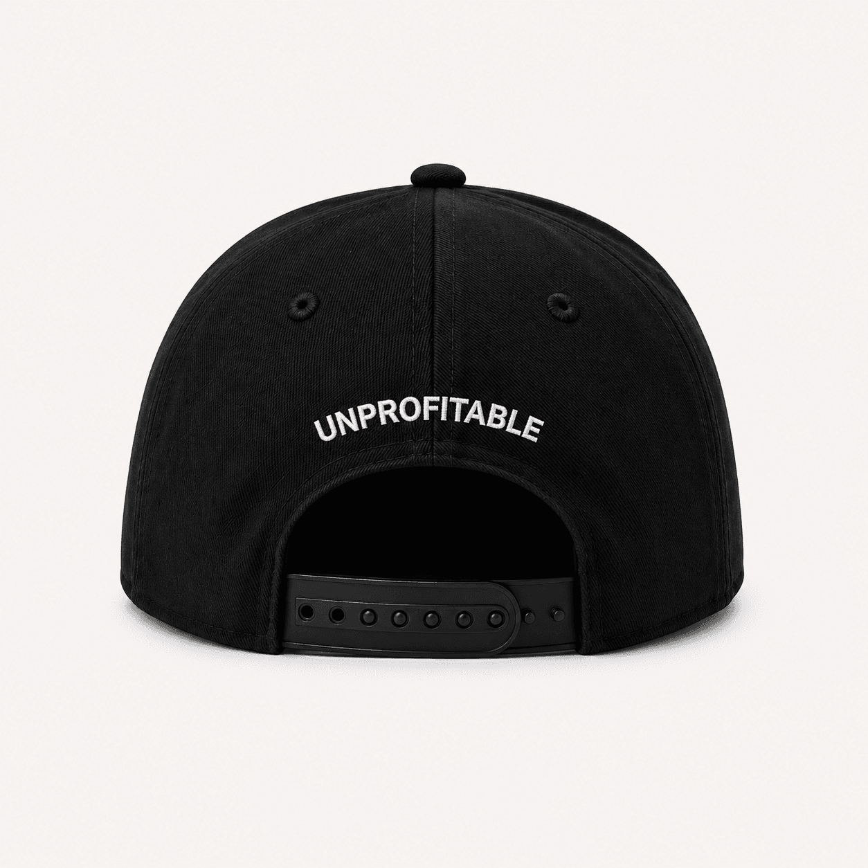 Back of the Disciplined structured hat: UNPROFITABLE embroidered above an adjustable back clip, on black.